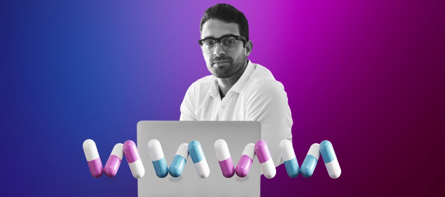 Image of a nutraceutical manufacturing professional behind a number of multi-colored dietary supplements.